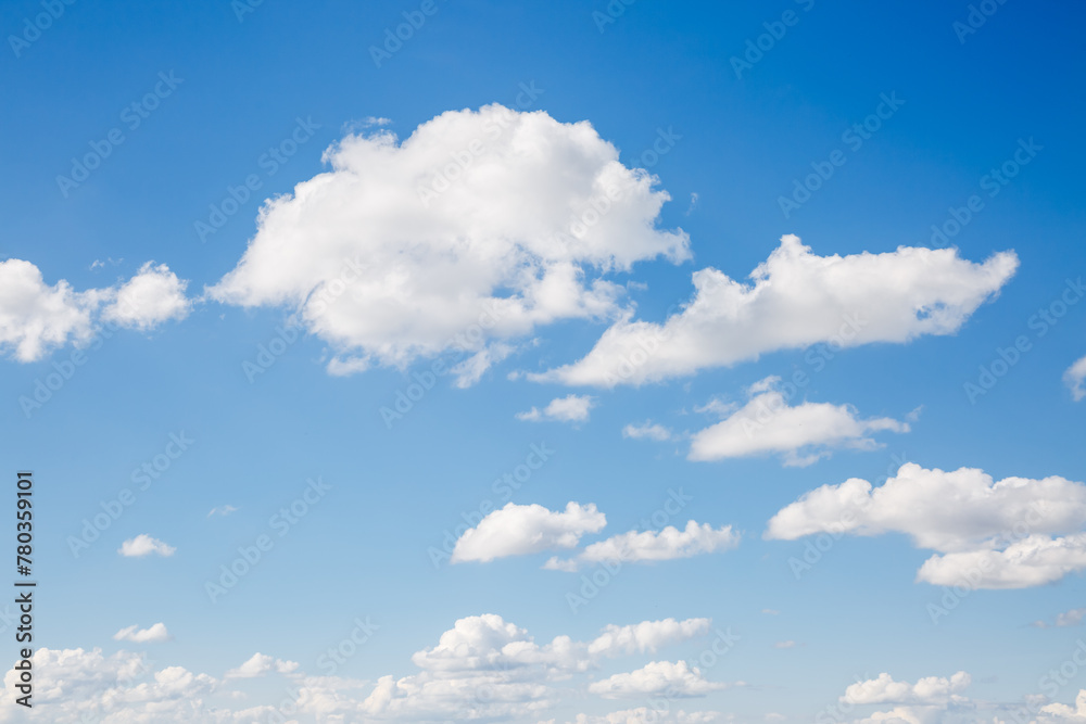 Fototapeta premium Picturesque sky background with white fluffy clouds.