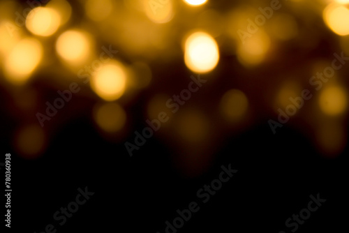 Abstract yellow glowing bokeh for background.