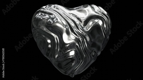 Realistic DOF abstract looping 3D animation of the beautiful morphing and waving liquid silver metal heart rendered in UHD with alpha matte