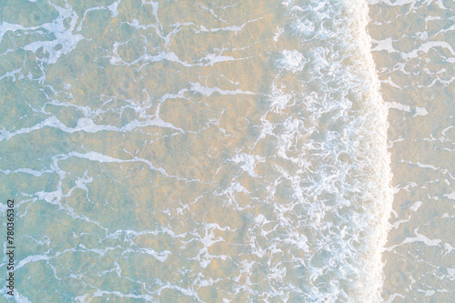 close up view of the sea water reaching the shore of the beach, texture for backgrounds