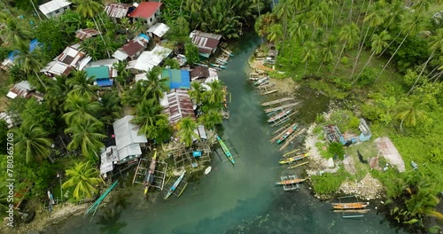 Tradional fishing boats floating over Bogac Cold Spring in Surigao del Sur. Philippines. photo