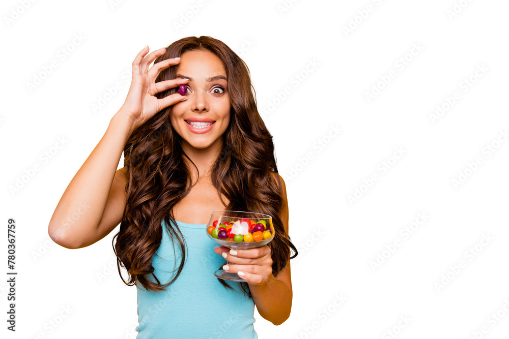 Close up photo beautiful her she wavy lady hide eye small candy hands arms goblet little sweets enjoy size taste quality wear blue teal green everyday short dress clothes isolated yellow background Close up photo beautiful her she wavy lady hide eye small candy hands arms goblet little sweets enjoy size taste quality wear blue teal green everyday short dress clothes isolated yellow background