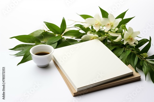 Book, coffee cup and orchid on white background drink table diary