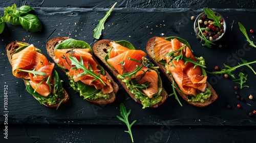 Open sandwich or toast. Grain bread with salmon, avocado and sesame seeds. Healthy snack, fat and omega 3 source