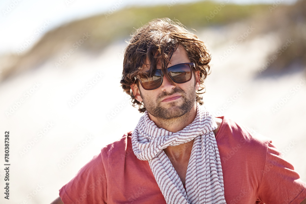 Man, sunglasses and portrait in dessert for vacation and relaxing break in summer holiday. Handsome male tourist or traveler and serious with scarf for travel aesthetic, adventure or explore outdoor Man, sunglasses and portrait in dessert for vacation and relaxing break in summer holiday. Handsome male tourist or traveler and serious with scarf for travel aesthetic, adventure or explore outdoor