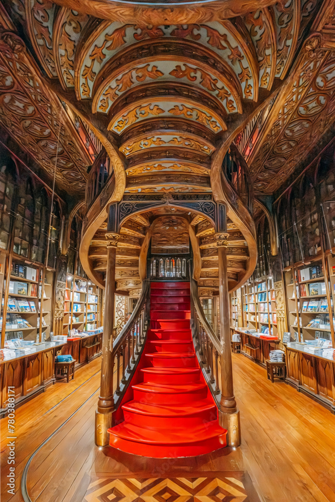 Fototapeta premium Porto, Portugal - October 30, 2023: Interior view of Lello bookstore (Portuguese: Livraria Lello) and its famous wooden staircase in historic center of Porto , famous for Harry Potter film (Porto)