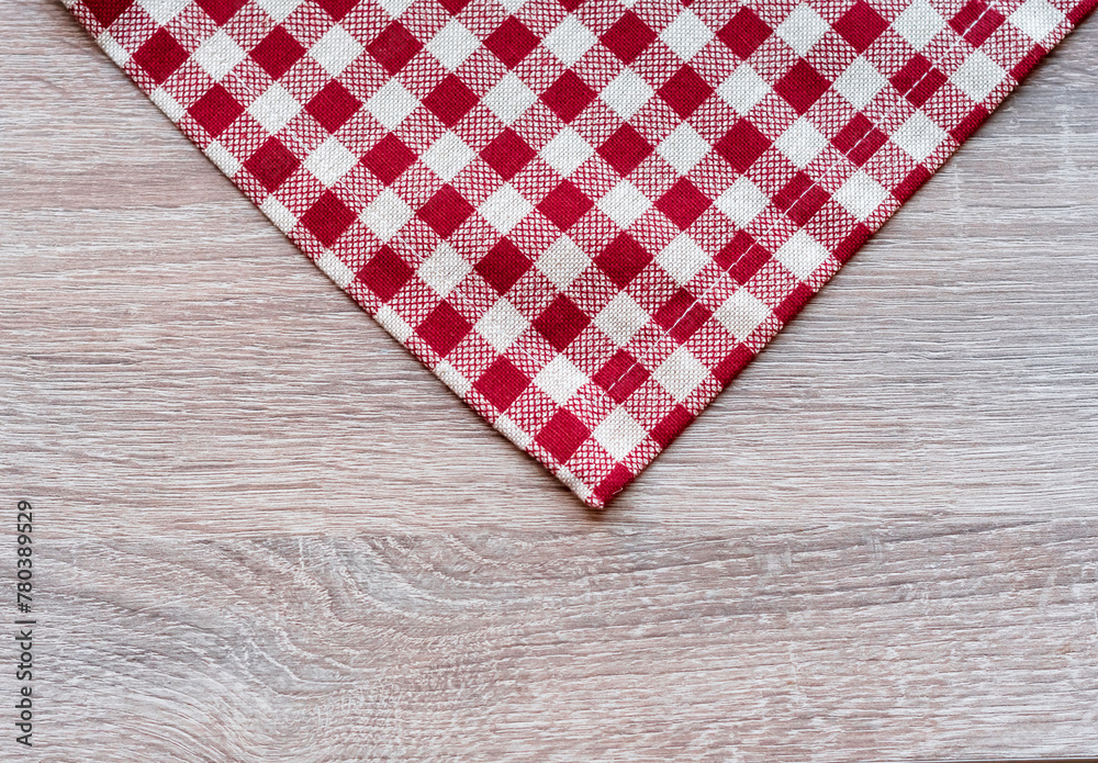 red and white tablecloth on wooden background