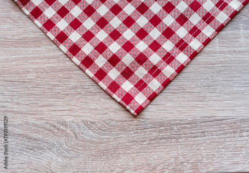 red and white tablecloth on wooden background