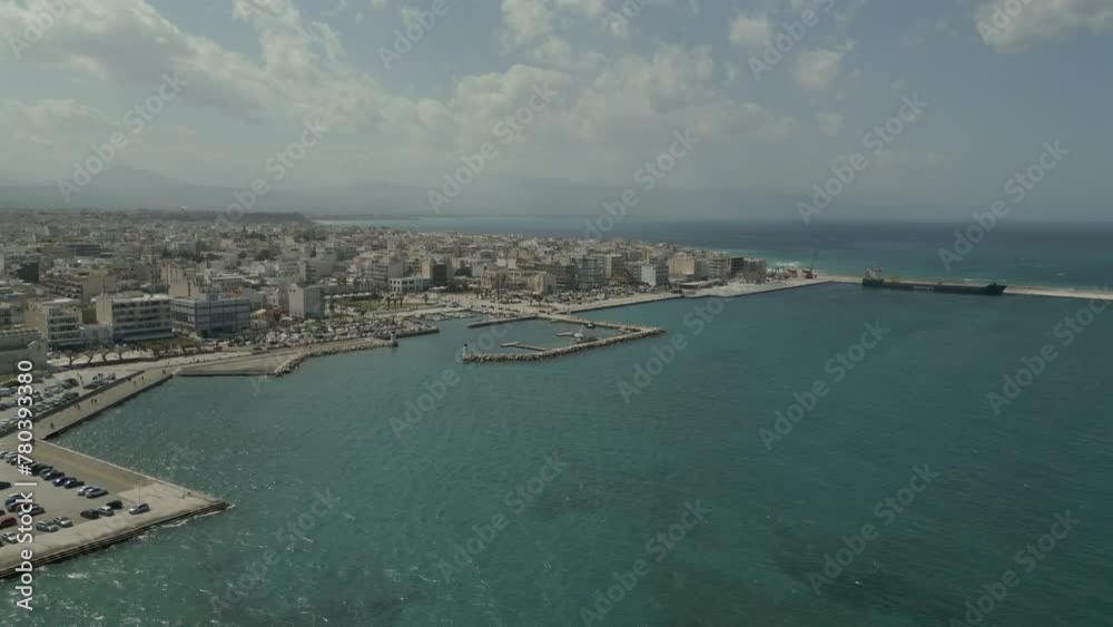 A drone captures the stunning coastline of Corinth, Greece, offering a breathtaking aerial view of the city's beauty. A drone captures the stunning coastline of Corinth, Greece, offering a breathtaking aerial view of the city's beauty.