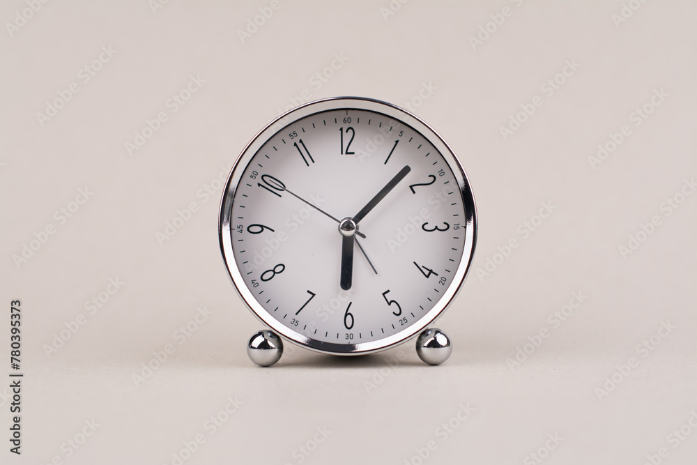 Time hand shows standing time. High quality studio photo of a clock. The concept of time and the rules of time in work Time hand shows standing time. High quality studio photo of a clock. The concept of time and the rules of time in work