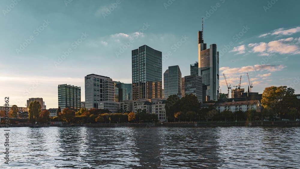 Frankfurt cityscape and the river Main with a skyscape in the background Frankfurt cityscape and the river Main with a skyscape in the background