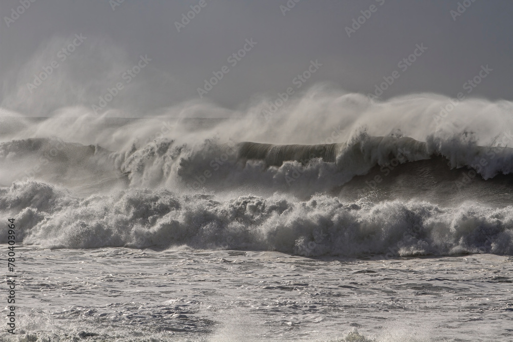 Rough sea with spraying breaking waves
