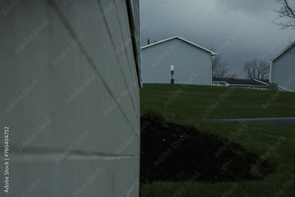 house with cloudy skies behind it house with cloudy skies behind it