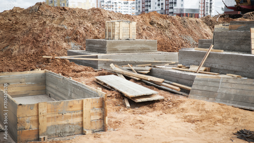 A concrete slab takes form amidst the hustle and bustle of a construction site, marking the beginning of a strong foundation A concrete slab takes form amidst the hustle and bustle of a construction site, marking the beginning of a strong foundation