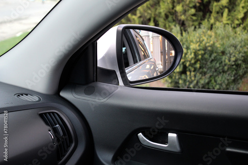 Inside view of car mirror. Look in the rear view mirror of a car. Side rear-view mirror on a car. © Best Auto Photo