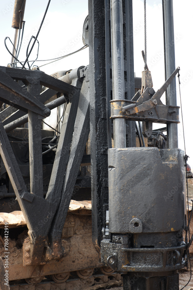 Pile driving machine. Diesel hammer pile driving machine working on construction site. Preparation of the pile foundation for the construction of the building. Close-up. Pile driving machine. Diesel hammer pile driving machine working on construction site. Preparation of the pile foundation for the construction of the building. Close-up.