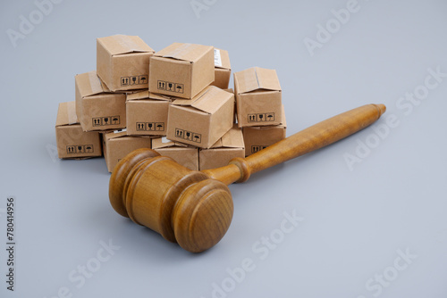 Wooden judge gavel and many carton boxes.	