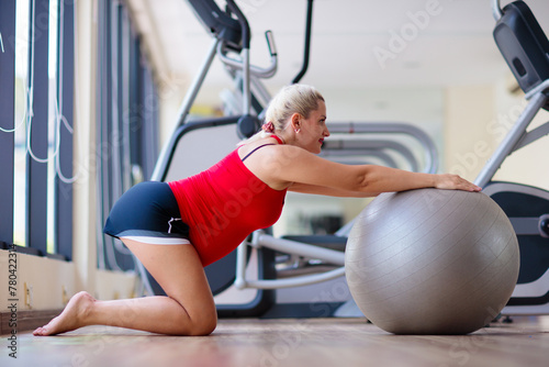 Pregnancy gym fitness. Pregnant woman exercising.