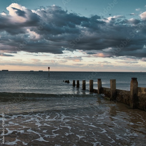 Cloudscape over the wavy sea with breakwaters  Isle of Wight  England