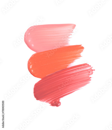 Strokes of different lip glosses isolated on white, top view
