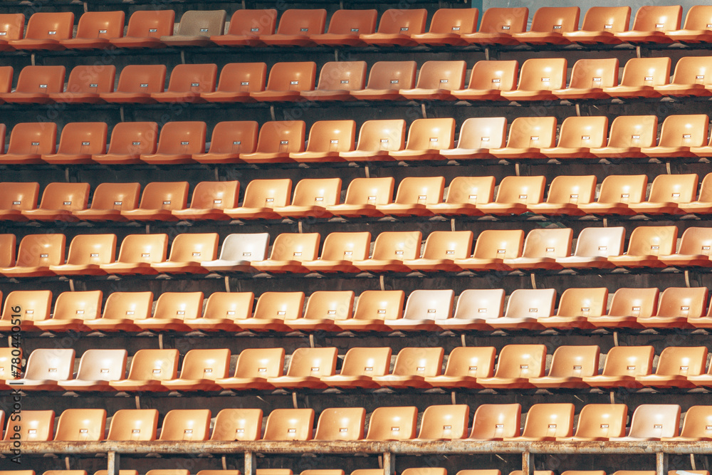 Large Aligned yellow rows of empty theater seats Large Aligned yellow rows of empty theater seats