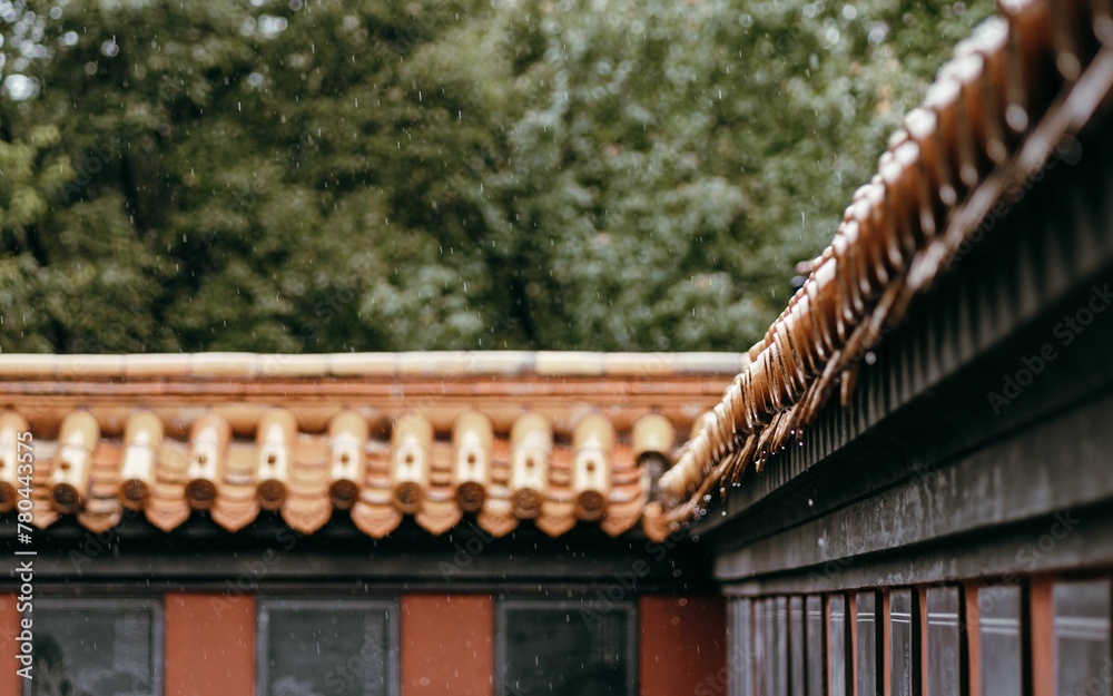 Raindrops falling on the roof tiles of traditional Chinese building Raindrops falling on the roof tiles of traditional Chinese building