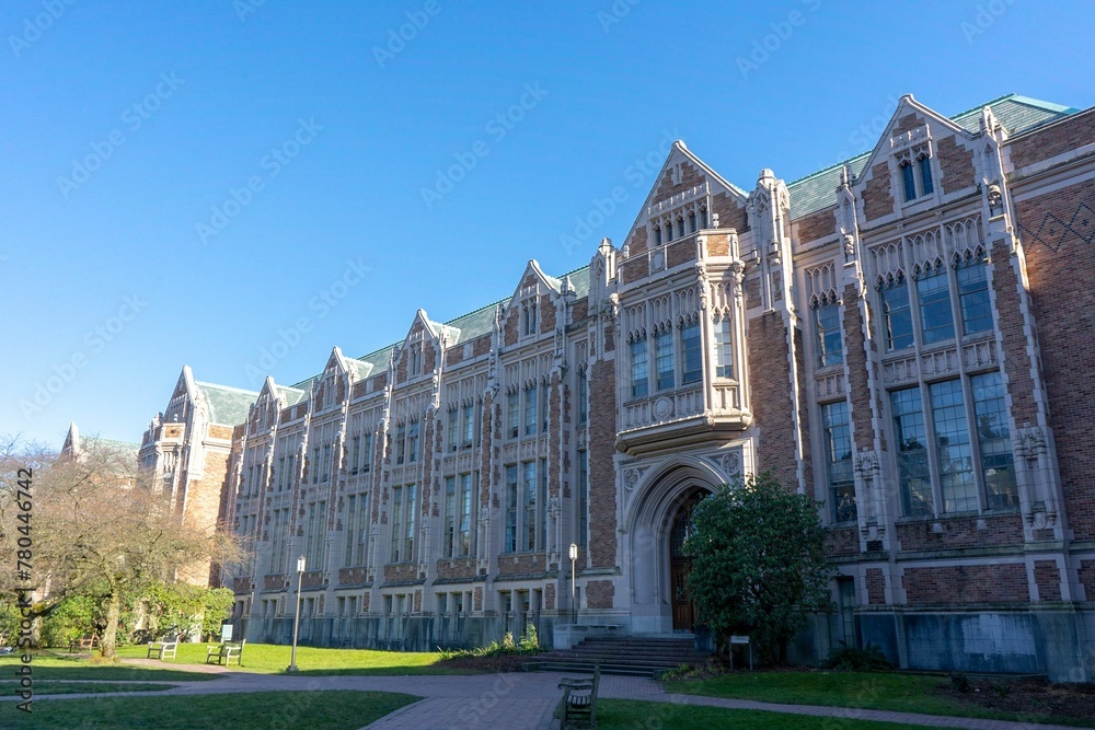 Exterior of University of Washington with garden in front of the facade under clear sky