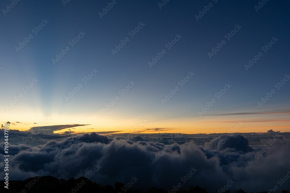 Beautiful shot of a layer of dark blue clouds in a sunset sky Beautiful shot of a layer of dark blue clouds in a sunset sky