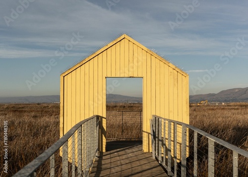 Wooden structure at the Alviso Marina County Park with a skyscape in the background photo
