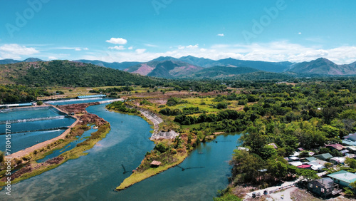 Slika na platnu Aerial shot of two splitting rivers surrounded by a wild landscape