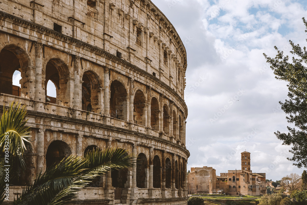 Obraz premium Famous arches on the Roman Colosseum facade. Coliseum at springtime.