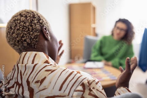 Rear view of female patient during therapy session photo