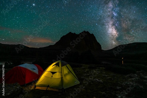 Closeup of tents on a Milky way sky and the Uinta Mountains background