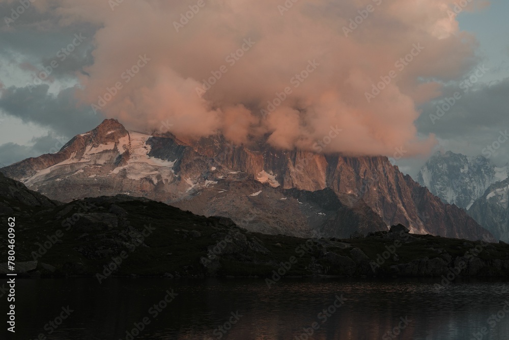 Fototapeta premium View of pink clouds covering the Mont Blanc massif mountaintop