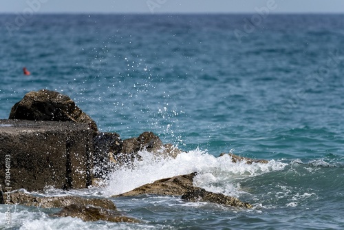 Beautiful view of waves washing the shore in Liguria Italy