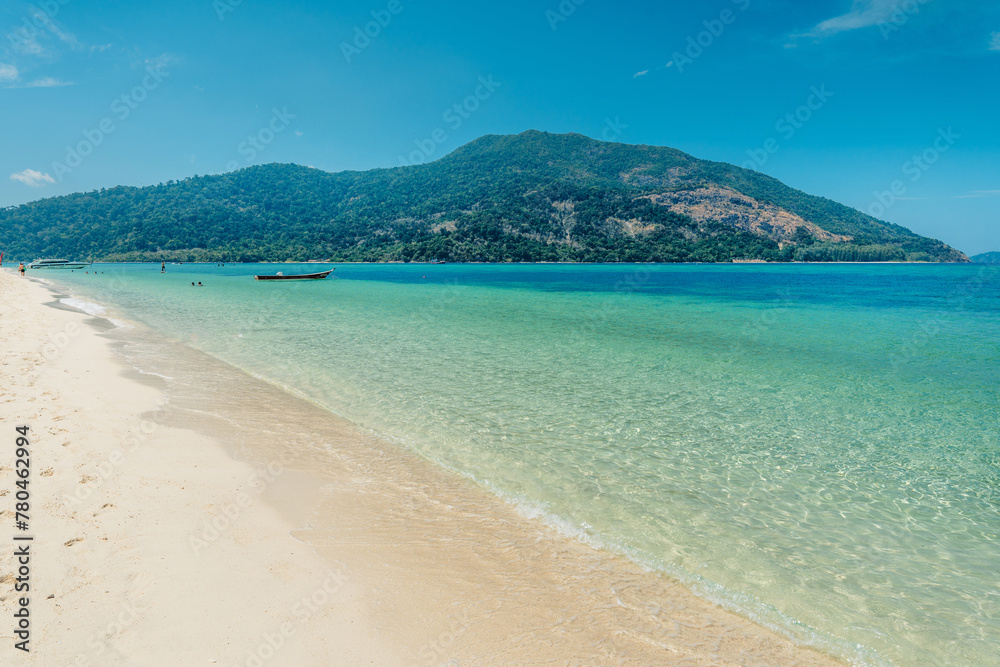 Beach and clear blue water in summer and vacation