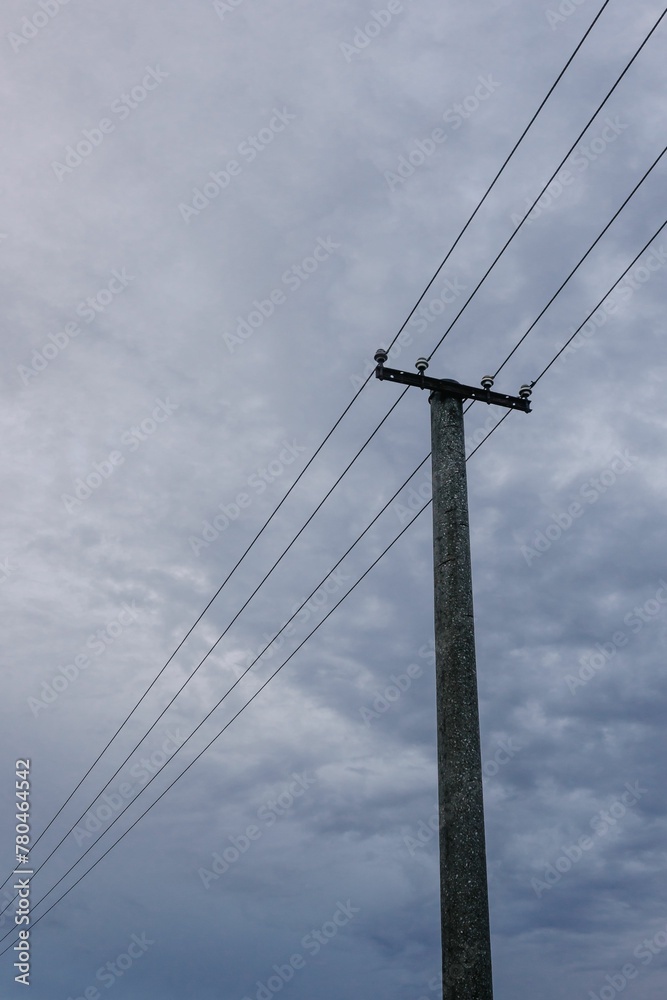 Transmission tower and cloudy sky, vertical Transmission tower and cloudy sky, vertical