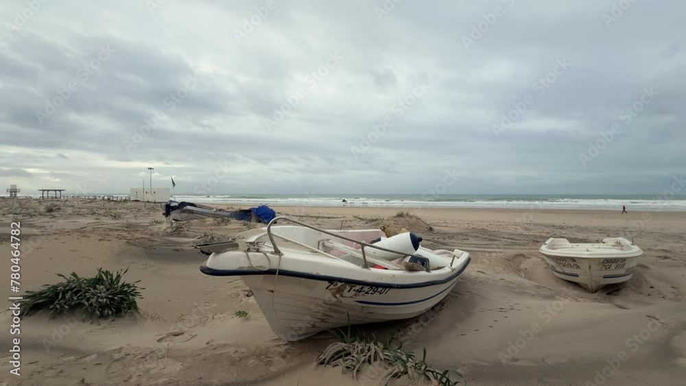 Time-lapse video showcasing the coastline and small boats on a sandy beach along the Spanish coast, embodying the idea of travel and vacation. Time-lapse video showcasing the coastline and small boats on a sandy beach along the Spanish coast, embodying the idea of travel and vacation.