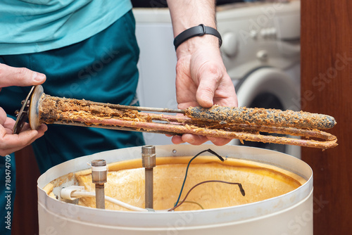 The water heating element of the boiler is covered with sediment and limescale. Boiler repair and maintenance