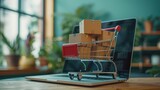 Concetto di shopping online con un carrello pieno di scatole sopra un computer portatile 