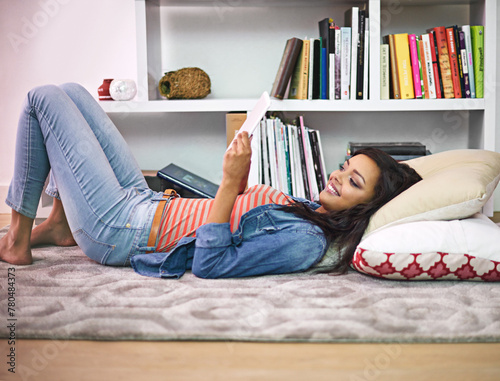Black girl, relax and happy on floor with tablet for online entertainment, social media or streaming trending videos. Person, digital technology and internet for connectivity and scroll on website.