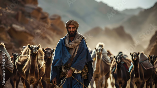 Berber man leading camel caravan. Morroco. photo
