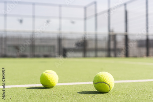 Tennis court with green grass and net outdoors