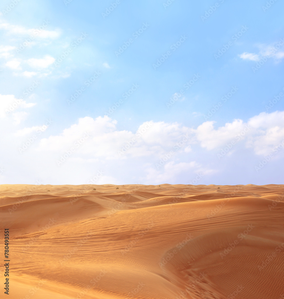 Beautiful landscape with sand dunes in desert and blue sky. Desert scene with red sand dunes