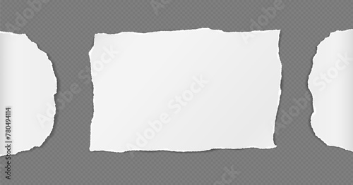 Torn, ripped white paper with soft shadow are on dark grey background for text or ad.