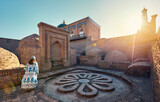 Woman tourist at old city Khiva in Uzbekistan