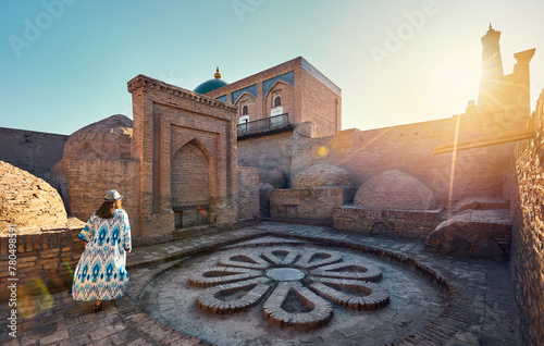 Woman tourist at old city Khiva in Uzbekistan