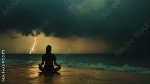 Person Meditating on Beach With Storm in Background