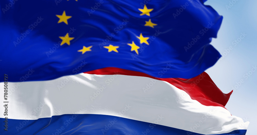 Flags of the Netherlands and the European Union waving Flags of the Netherlands and the European Union waving