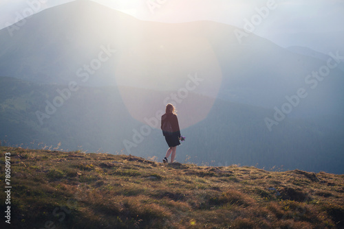 Young Girl in Black Outfit Walks in High Carpathian Mountains